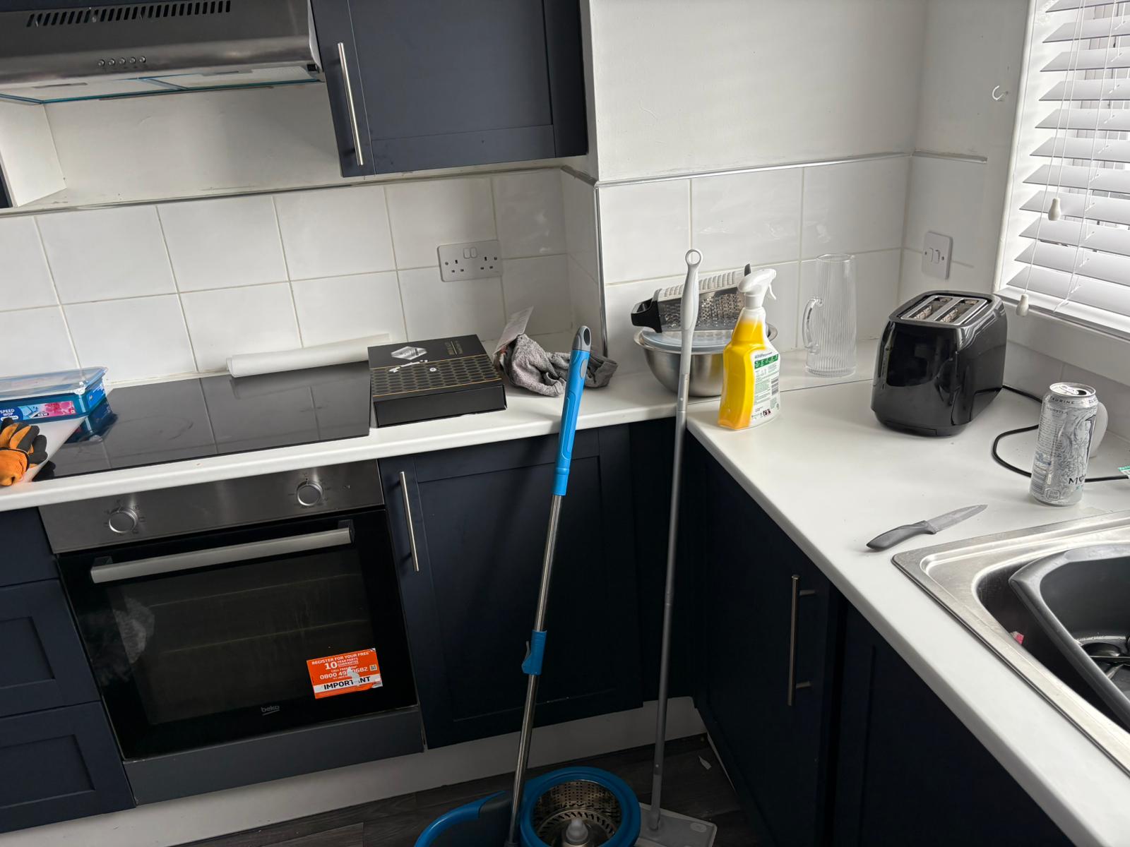 Kitchen mid-clean with cleaning equipment