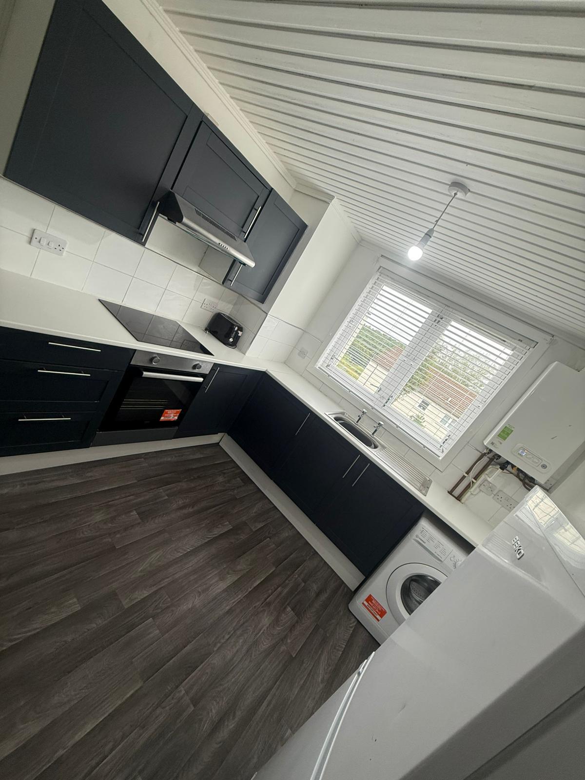 Cleared and cleaned kitchen, ready for handover